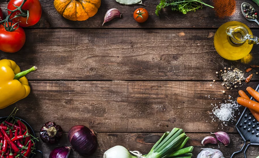 rustic wooden plank with fresh organic vegetables