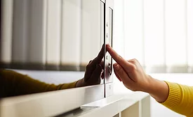 Woman using a microwave in the office