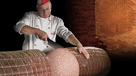 Specialist slices giant mortadella