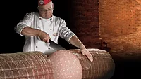 Specialist slices giant mortadella