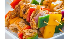 GOOD Meat cultivated chicken kebab with couscous served at Huber's Butchery Bistro