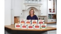 Photo of Heidi Meyer, founder and co-creator of Pound of Ground Crumbles, standing in front of the Pound of Ground Crumbles product