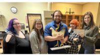 Courtney Happ (right), professor and animal science instructor, with several animal science students