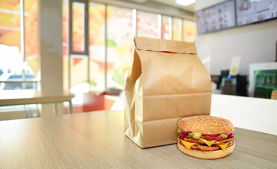 Cheeseburger and craft paper bag