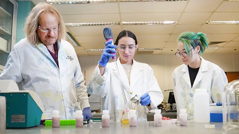 Professor of food science Bruce Applegate works with students to develop a faster testing method for pathogenic E. coli in beef