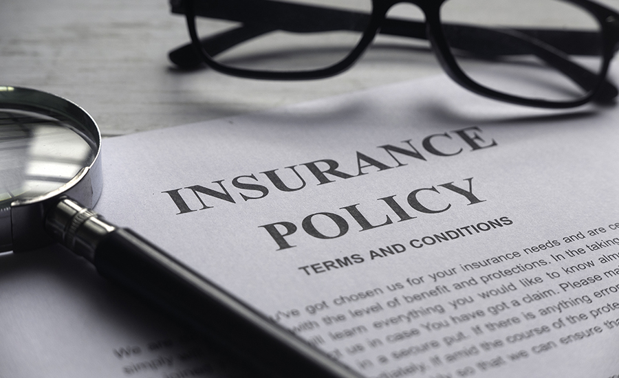 magnifying glass,glasses and Insurance Policy letter