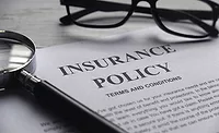 magnifying glass,glasses and Insurance Policy letter