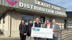 Representatives from Draper Valley Farms in Mount Vernon, Wash., present the Skagit Food Distribution Center with a $10,000 Perdue Foundation grant.