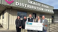 Representatives from Draper Valley Farms in Mount Vernon, Wash., present the Skagit Food Distribution Center with a $10,000 Perdue Foundation grant.