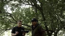 Richard Schofield, general manager for Whāngārā Farms, and Matt Harcombe, sustainability manager for Silver Fern Farms, discussing Net Carbon Zero mapping of the farm.