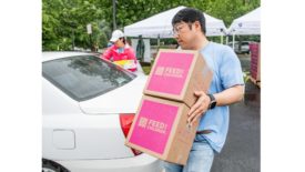 A Dulles Corridor family receives food and essentials as part of Summer Food Distribution program run by StarKist, Feed the Children and Cornerstones