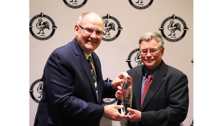 John Starkey presenting the PSA Distinguished Poultry Industry Career Award to Dr. Steven Ricke
