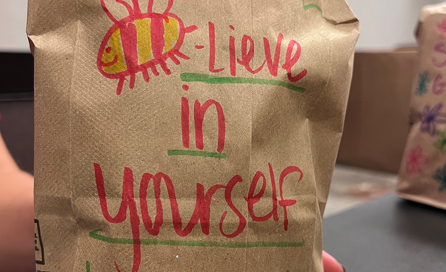 "Believe in yourself" on a paper bag