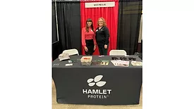 Megan Bible and Melissa Kirschner at the Passion for Pigs booth