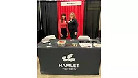 Megan Bible and Melissa Kirschner at the Passion for Pigs booth