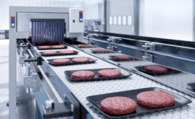 burgers in a factory being sealed