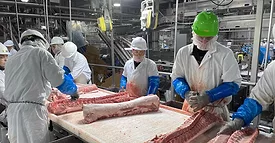people slicing meat 