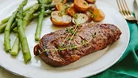 Ribeye plated with potatoes, asparagus Ribeye plated with potatoes, asparagus