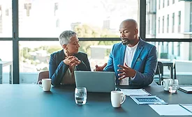 Business, presentation and man on a laptop in a corporate conference or office collaboration with a woman at work. 