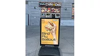 Bird Flu Bailout advertisement in front of a New York bodega