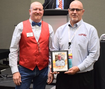 Scott Filbrandt, outgoing AAMP president (left), with Cured Meats Hall of Fame inductee Mark Reynolds.