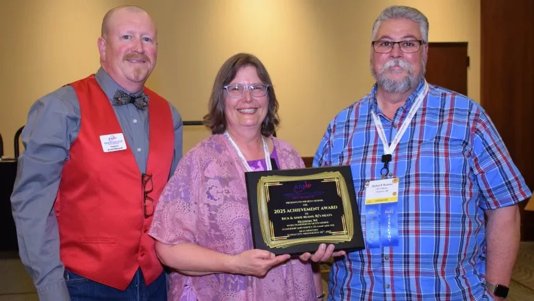 Scott Filbrandt, outgoing AAMP president, with Rick and Anne Reams of RJ’s Meats
