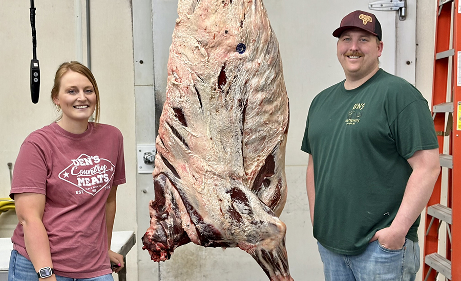Courtney and Seth Shreve of Den's Country Meats with a large cut of meat