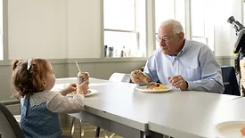 Louis Eni, CEO of Dietz & Watson, shares lunch with his granddaughter