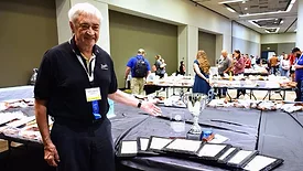 Louis Muench, president of Louie’s Finer Meats, with his ACMC awards