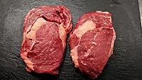 Raw steaks Raw steaks