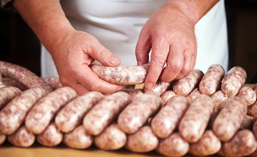 man preparing sausages