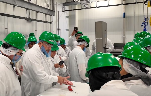 Colorado State University Professor Robert Delmore discusses yield management during an instructional session in the meat lab.