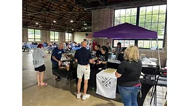 Attendees purchasing food at Wild Iris