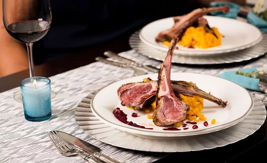 The image shows a rack of lamb, a cut of lamb that includes the ribs.