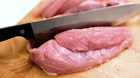 Chopping chicken breast