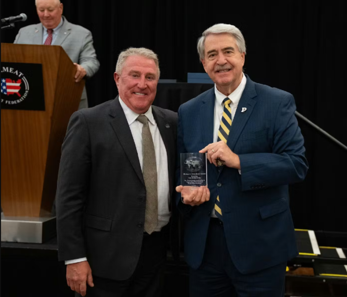 Ted McKinney (right) receives the Michael J. Mansfield Award from USMEF President and CEO Dan Halstrom