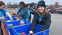 Jessica Scarlett, brand manager, Smithfield Foods, organizes donated food items during the Mayflower Marathon Holiday Food and Fund Drive. Jessica Scarlett, brand manager, Smithfield Foods, organizes donated food items during the Mayflower Marathon Holiday Food and Fund Drive.