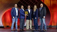 Sysco representatives Joe Don Eilers and Jeremy Melloan (second and third from left, respectively), receive the 2026 Beef Quality Assurance Marketer of the Year award at NCBA Cattle Convention.