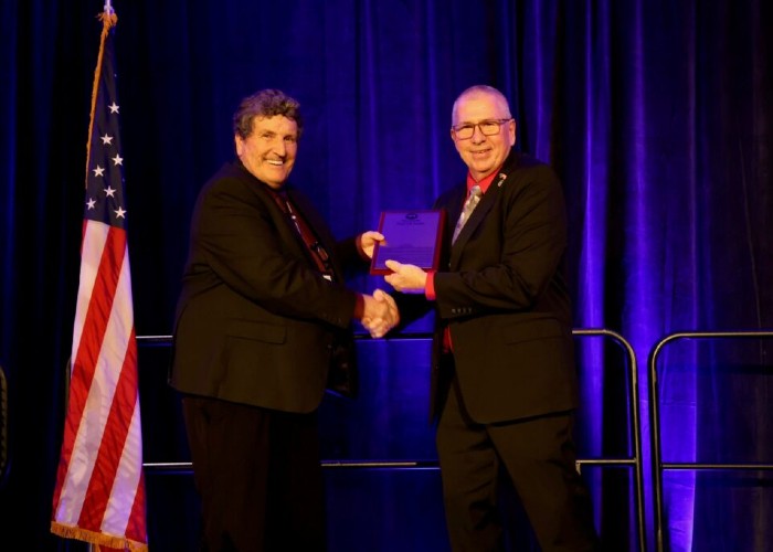 Sam Carney is presented with the Pork Industry Hall of Fame award in recognition of his contributions to the pork industry
