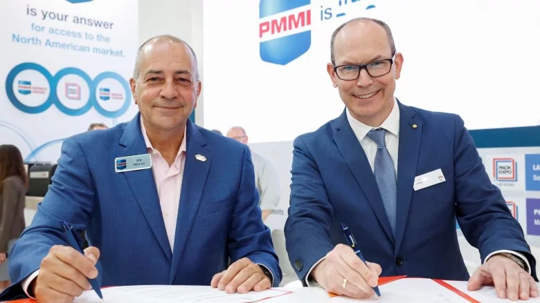 Jim Pittas, president and CEO, PMMI (left) and Thomas Dohse, director of interpack (right) sign Memorandum of Understanding