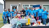 Smithfield Foods employees partnered with Operation Homefront to support the Stout family’s move into their new home.