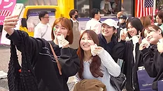 Participants at the Shibuya-Omotesando Women’s Fun Run in central Tokyo eat samples of American salad pork.