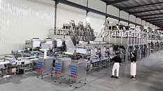 Automated packing line integrating weighing, filling and packaging systems for snack, ready meal and wet pet food manufacturing applications.