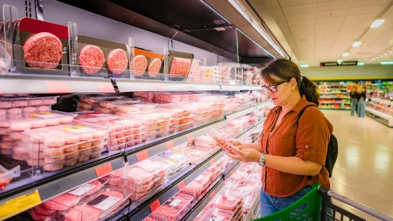 Woman buying groceries at supermarket