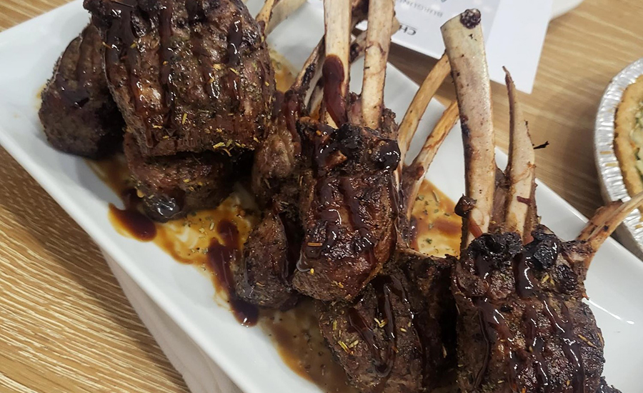 Herbed Garlic & Meyer Lemon Crusted Air Fried Lamb Chops, w. Balsamic Hot Honey Reduction on a plate.