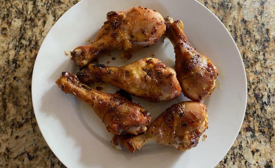 Wasabi Miso-Roasted Garlic Drumsticks on a white plate