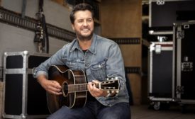 Country music singer Luke Bryan returns to roots, supports pig farmers