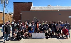 Representatives from Smithfield Foods’ Monmouth, IL facility present a $15,000 check to Recharge Teen Center on Friday, June 3.