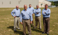 The executive team of Universal Pasteurization Co. outside the company's Villa Rica, Ga., processing facility