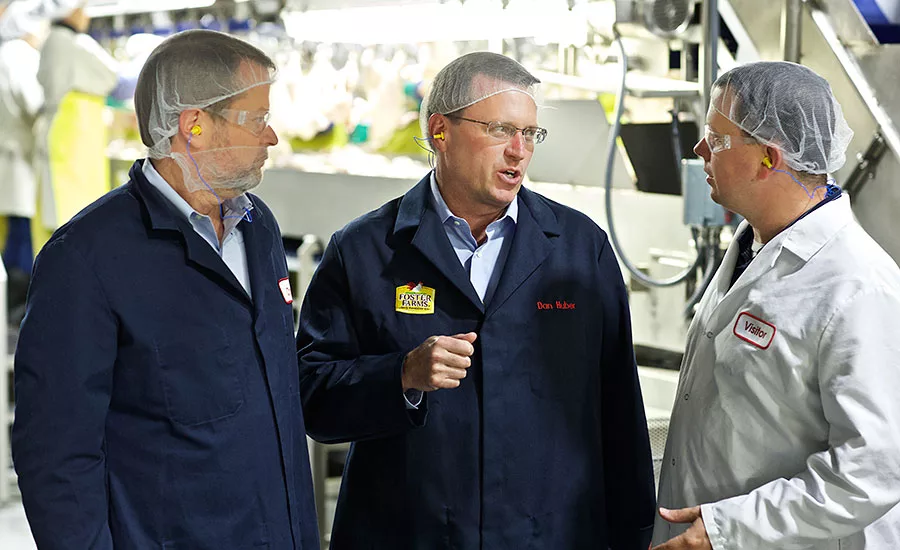 Chris Carter and Dan Huber of Foster Farms discuss the renovations at Foster Farms' Livingston, Calif., processing facility
